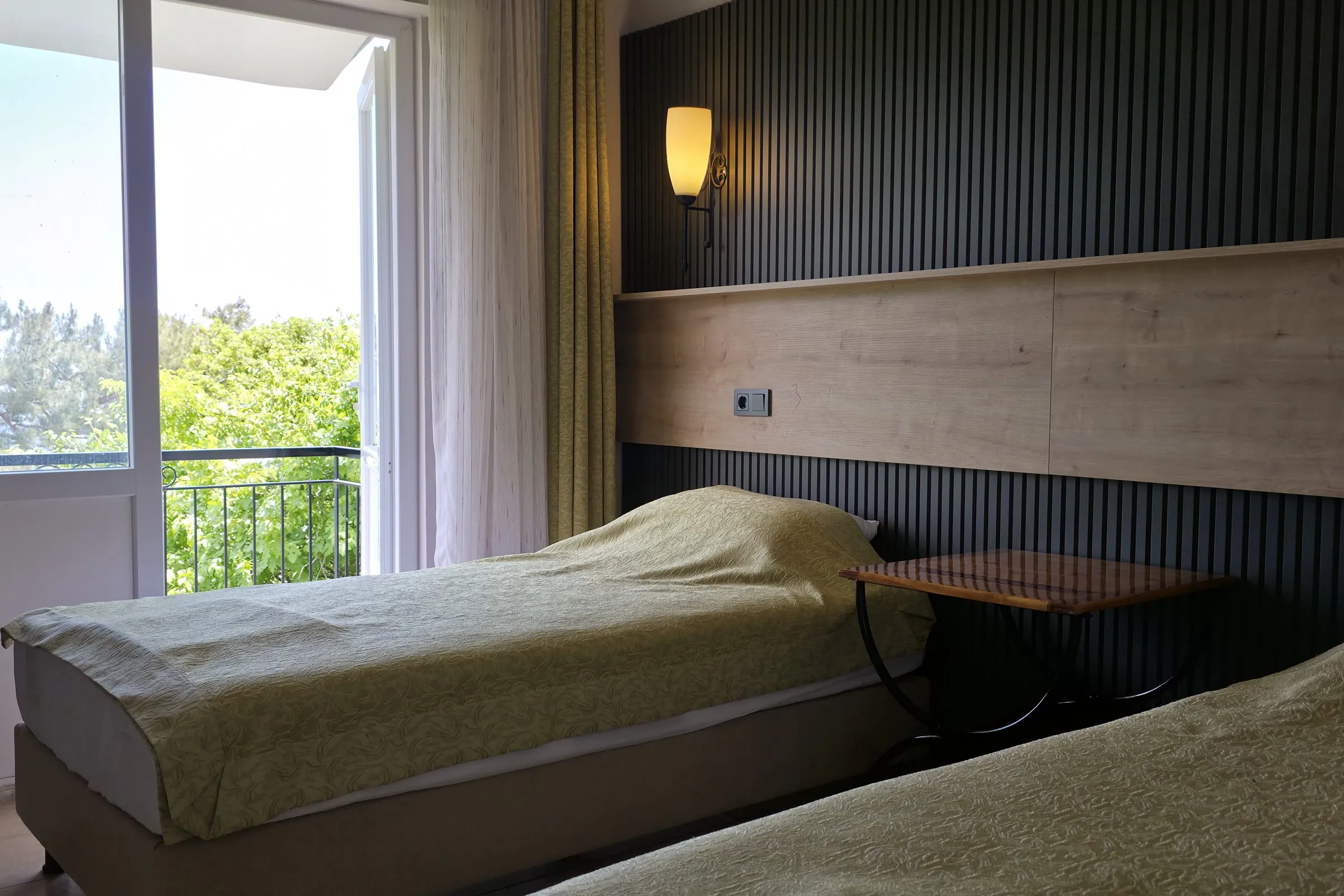 A twin room opening onto the balcony.